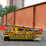 oversized load truck with sign