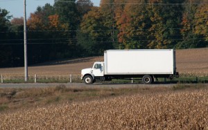 white truck driving in the country in the fall