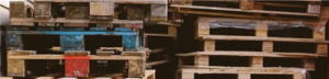 stack of blue tinged shipping wooden pallets