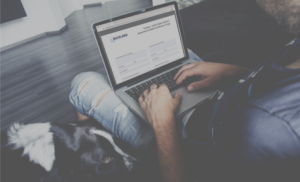 A man on his laptop on Bucklands website