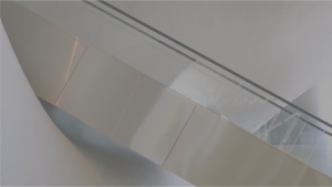 Aluminum escalator in-front of white wall