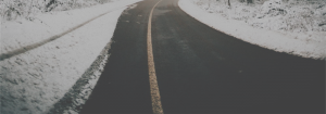 image of road with snow on sides of road