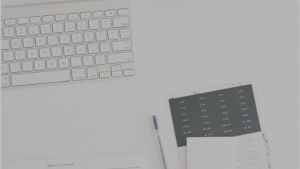 keyboard and notepad on desk