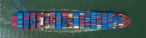 overhead image of container ship in the water