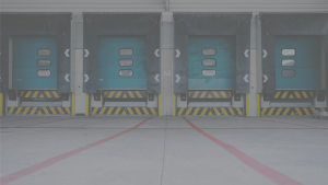 Four blue dock doors at warehouse